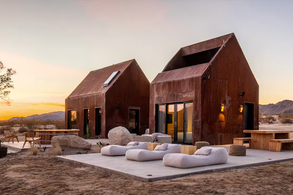 Sleep in a comfy bed under the stars in an open-air room in a minimalist steel structure. This innovative oasis as a unique off-grid getaway.